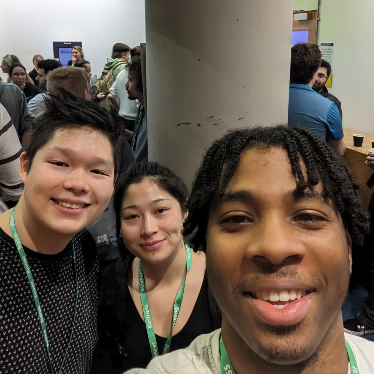 Three participants together at a hackathon